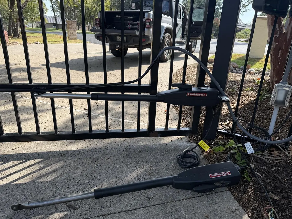 LiftMaster operator arm and installation components.