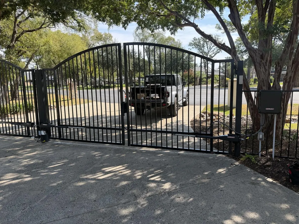 Double swing gate shown closed with the control enclosure secured.