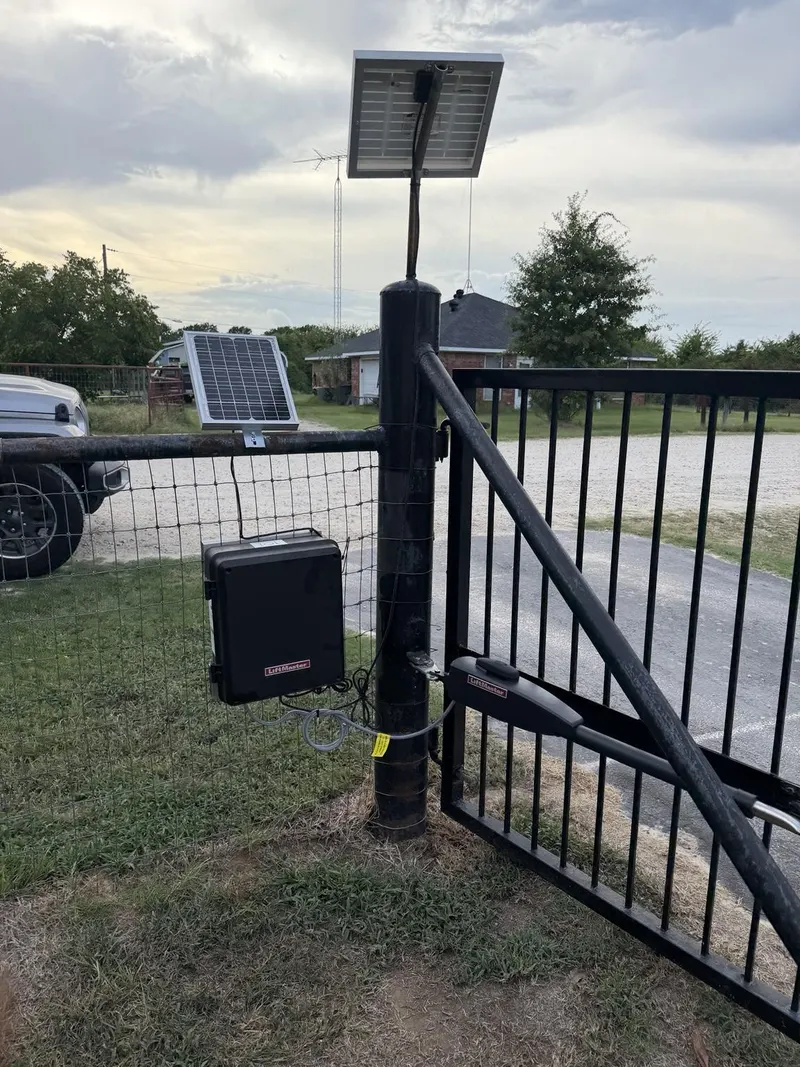 Two solar panels facing different directions, with the control enclosure closed.