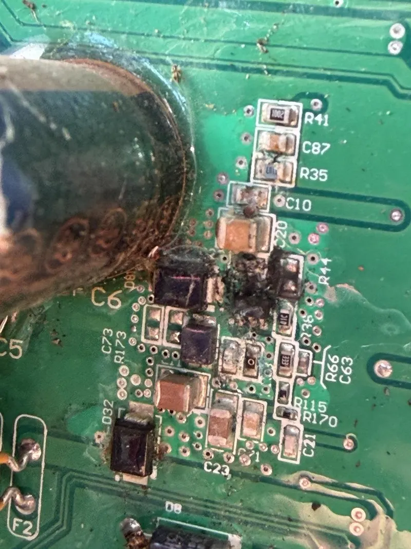 Original green circuit board with visible corrosion and contamination.